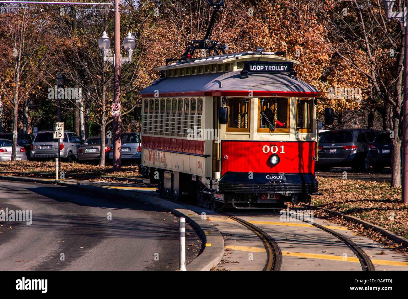 Saint Louis, MO--Nov 24, 2018; historic wooden Loop Trolley running on street tracks between Forest Park and University City in fall Stock Photo