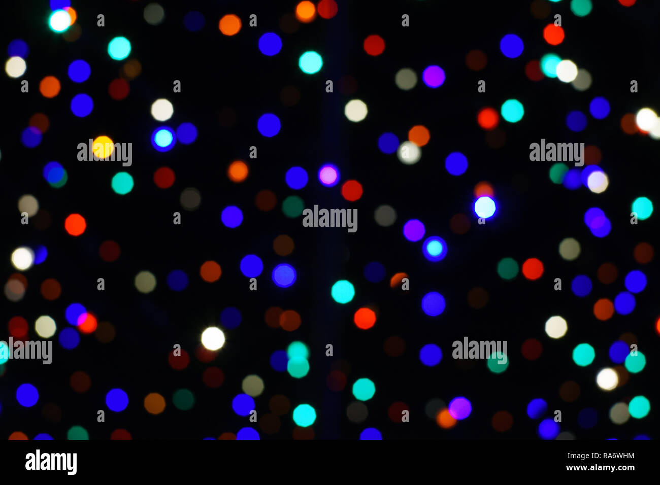 Light circles, bokeh, rainbow, christmas lights, dark background Stock Photo