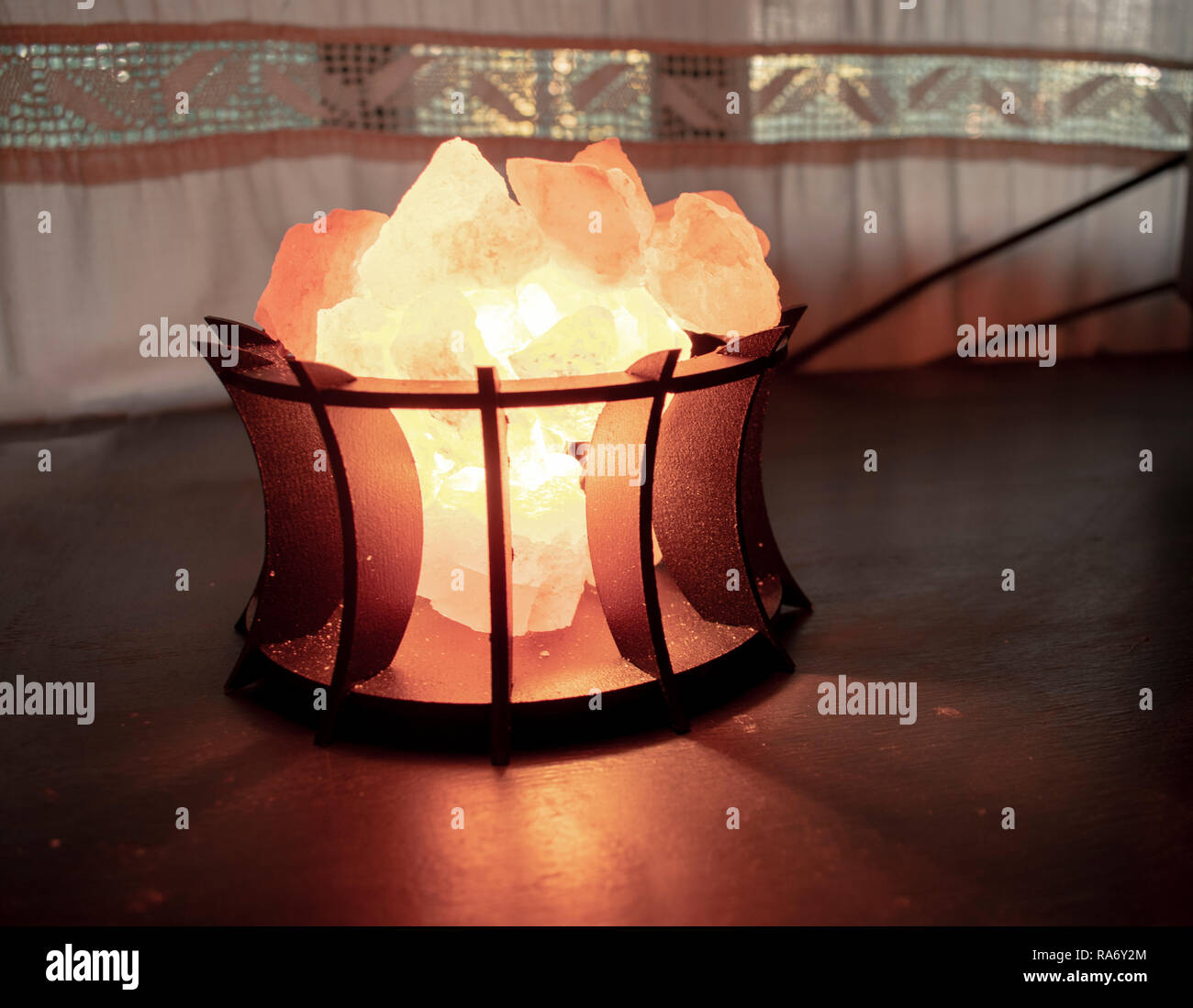 A salt lamp to decorate furniture Stock Photo - Alamy