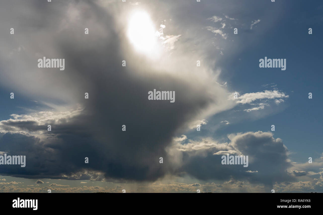 the sun making its way through the clouds Stock Photo - Alamy