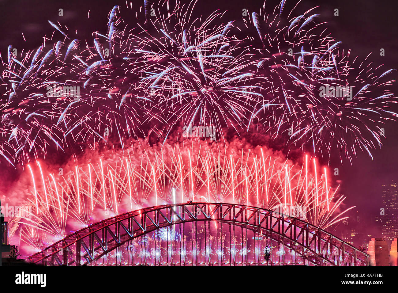 Bright red balls over the top of Sydney Harbour bridge arch against