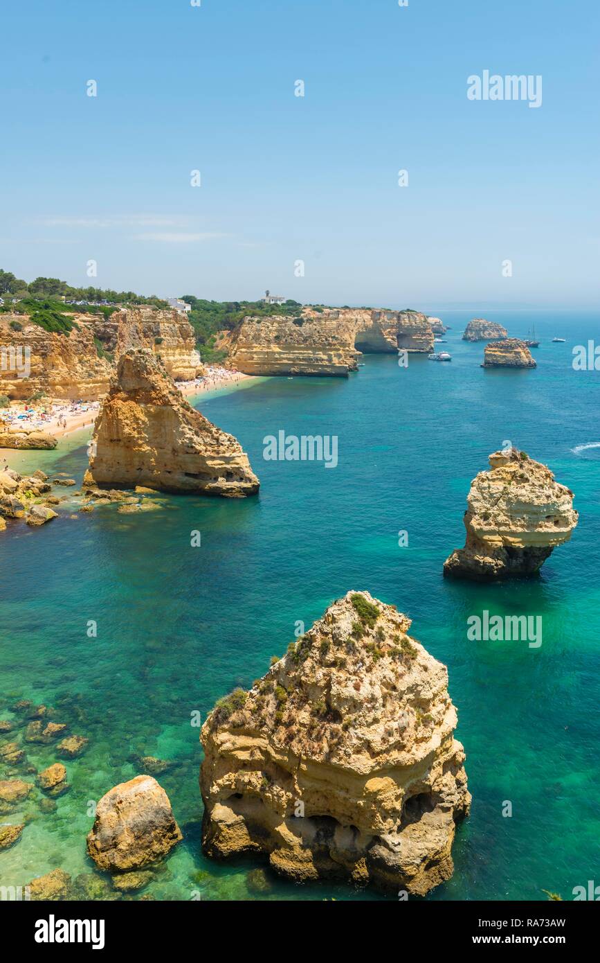 Turquoise sea, Praia da Marinha, rugged rocky coast of sandstone, rock