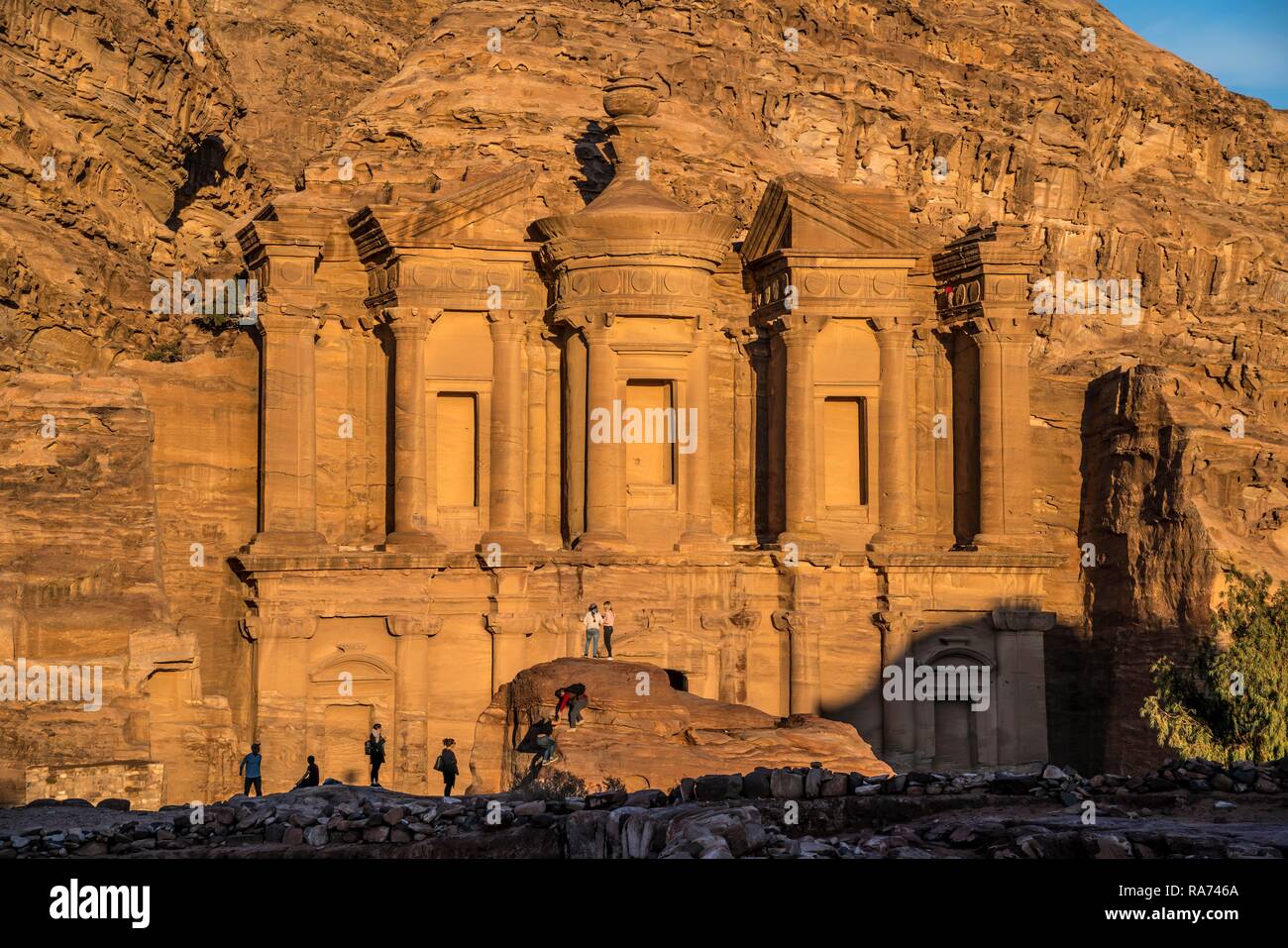 Visitors in front of the rock temple Monastery Ad Deir, Petra, Jordan Stock Photo