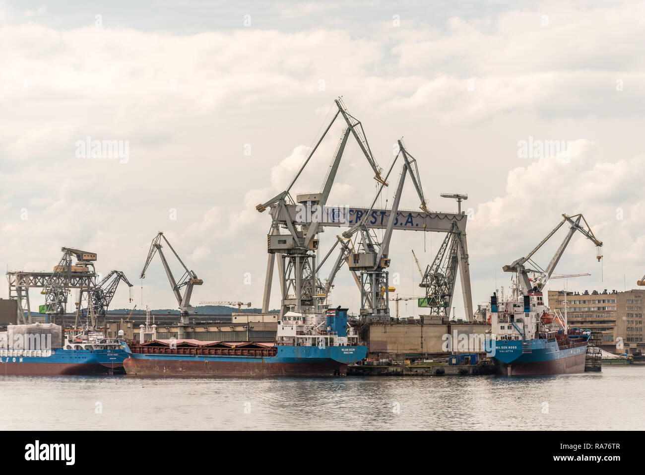 Gdynia, Poland. August 25, 2018: Views from excursion ship around  Gdynia Harbour. Cranes and vessels at wharf Stock Photo