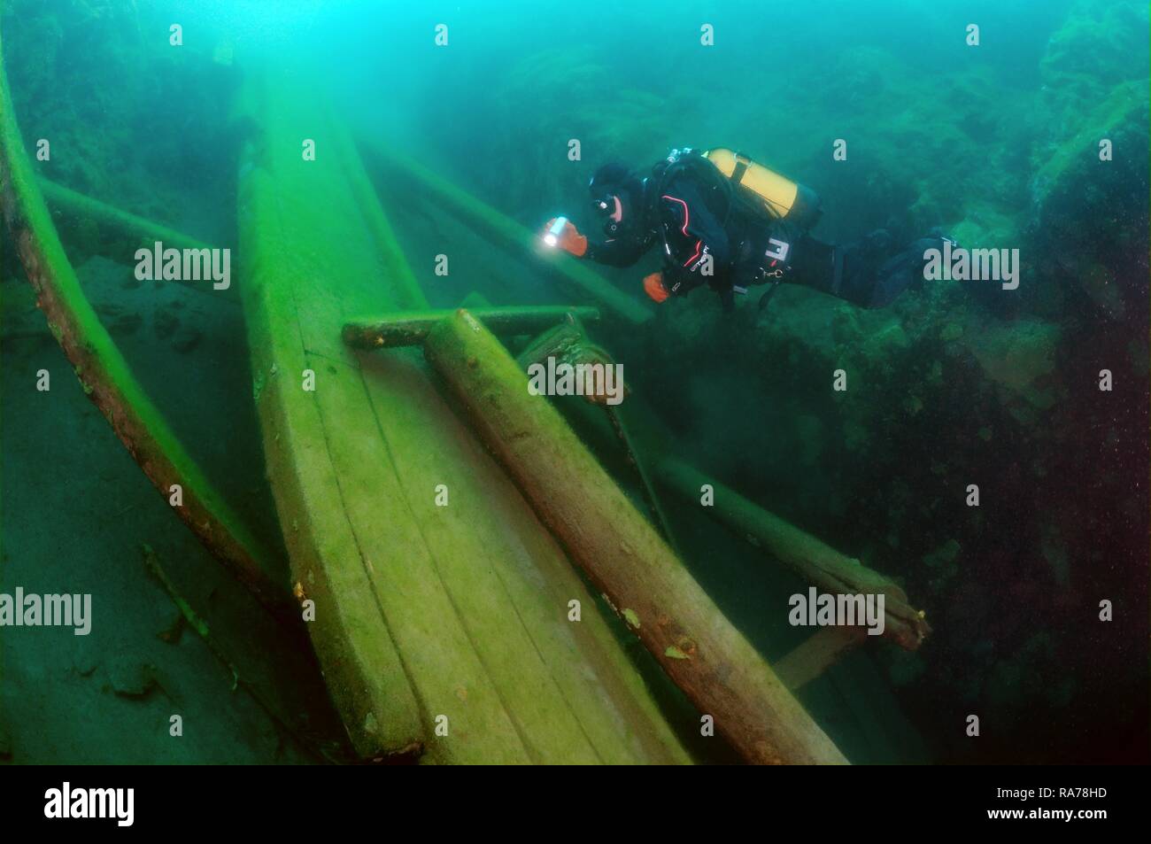 Diver surveys the destroyed wooden mooring, lake Baikal, Siberia, Russia, Eurasia Stock Photo