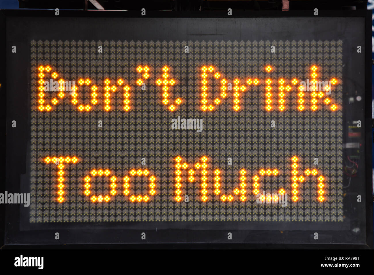 Don't drink too much matrix sign for New Year's Eve revelers in London, UK. Warning message Stock Photo