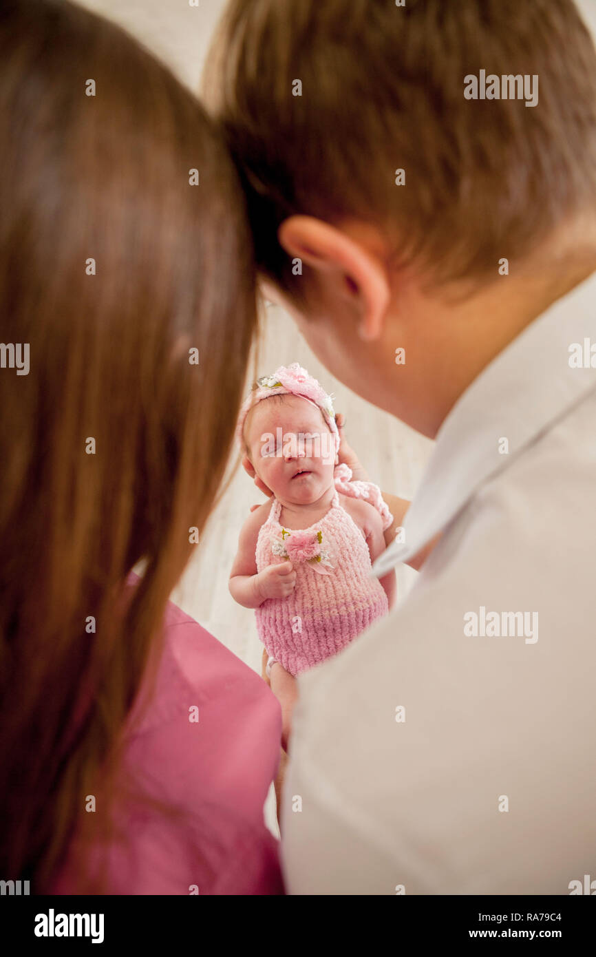 young couple with cute little baby. Smiling mother and father ...