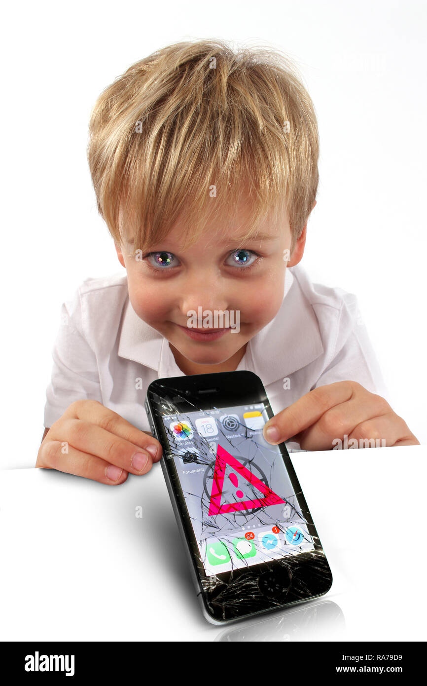 Boy holding, showing display of smartphone, cellphone demonstrating internet safety with symbols caution, forbidden, check mark, recycle Stock Photo