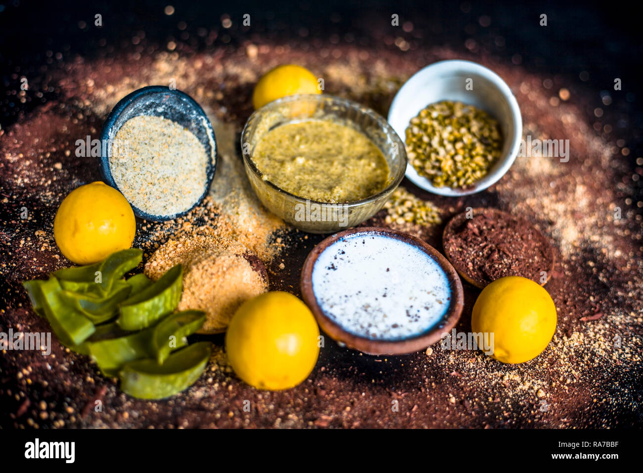 Ayurvedic face pack or ubtan of moong dal or green lentil or mung dal with lemon,dried orange peel powder,chandan powder or sandal wood powder,milk an Stock Photo