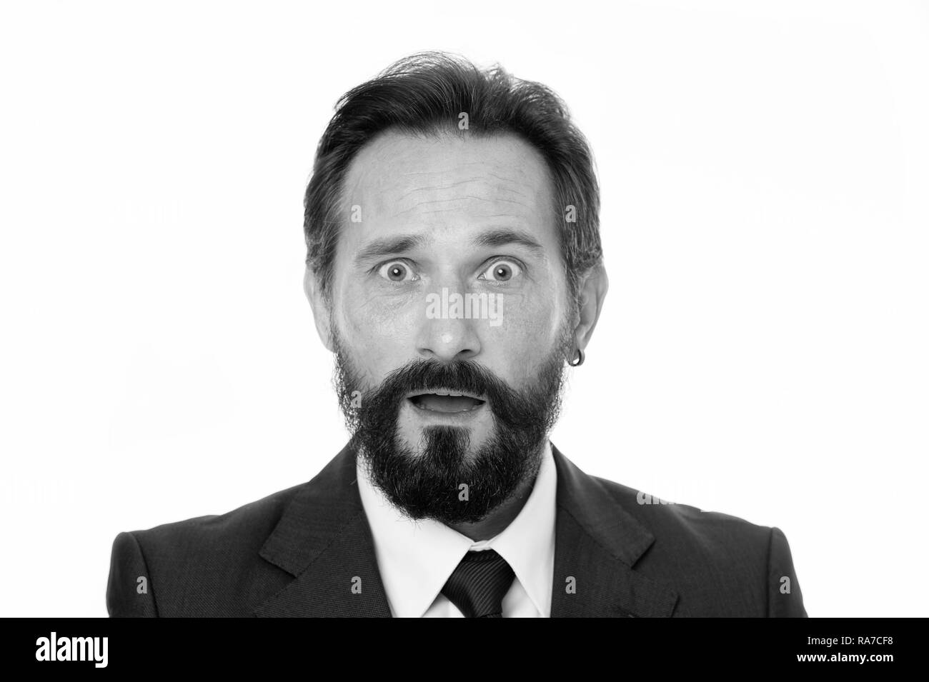 Experienced but confused. Male face puzzled confused with beard and mustache close up. Business people dress code. Business style appearance. Businessman classic formal clothing modern detail earring. Stock Photo