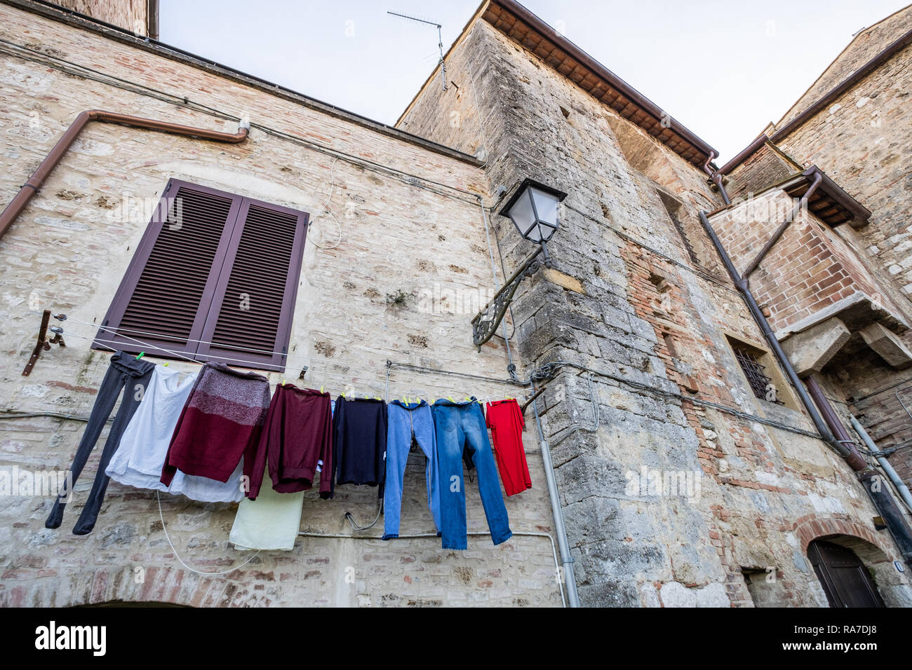 Cloths spread in Piazza della Misericordia in the oldest part of Colle Val d'Elsa, Siena, Tuscany Stock Photo