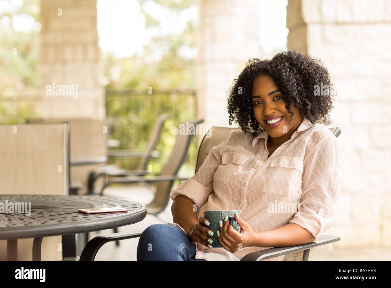 Portrait of an African American woman drinking coffee Stock Photo - Alamy