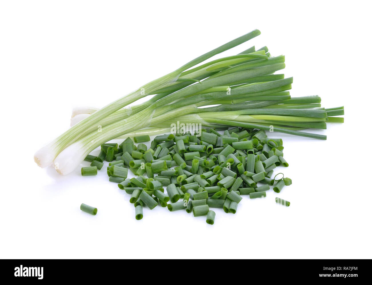 Onion leaves on white background Stock Photo - Alamy
