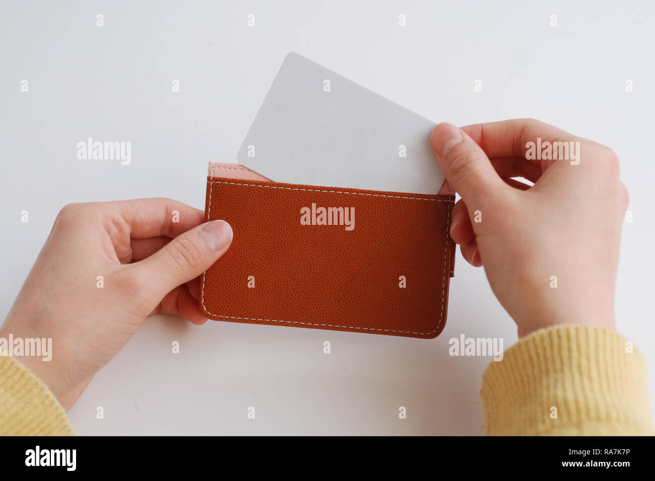 scene of putting card in wallet Stock Photo Alamy