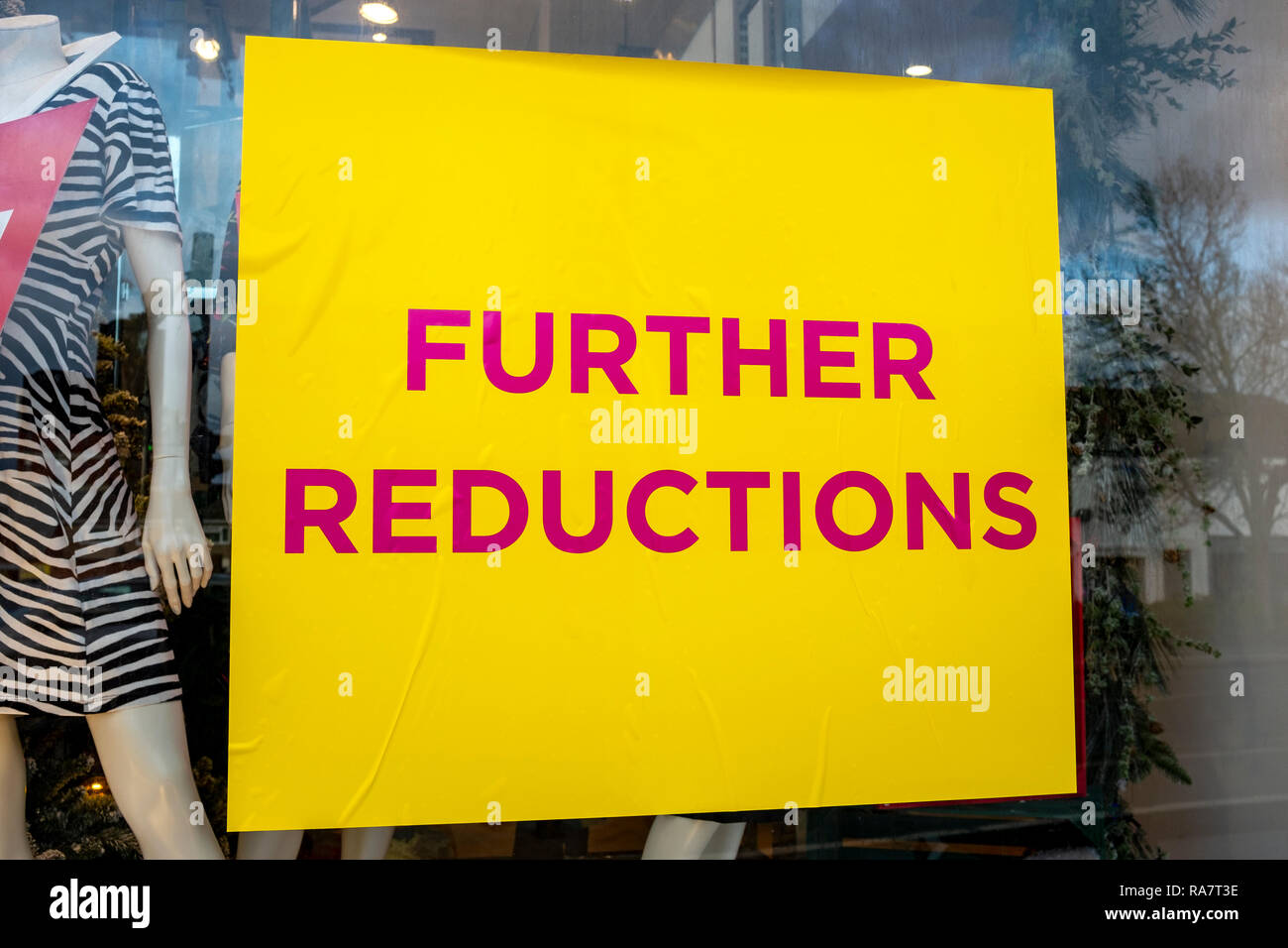Further reductions sale sign on shop window UK Stock Photo
