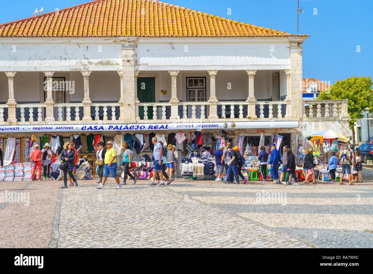 View of the central street and square with traditional shops at picturesque seaside village Nazare Stock Photo