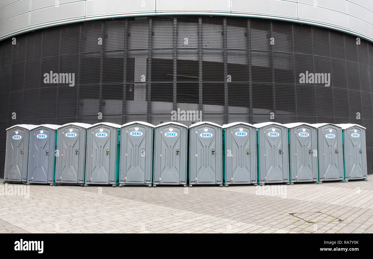 Many portable toilets, set up in series during an event, Stock Photo