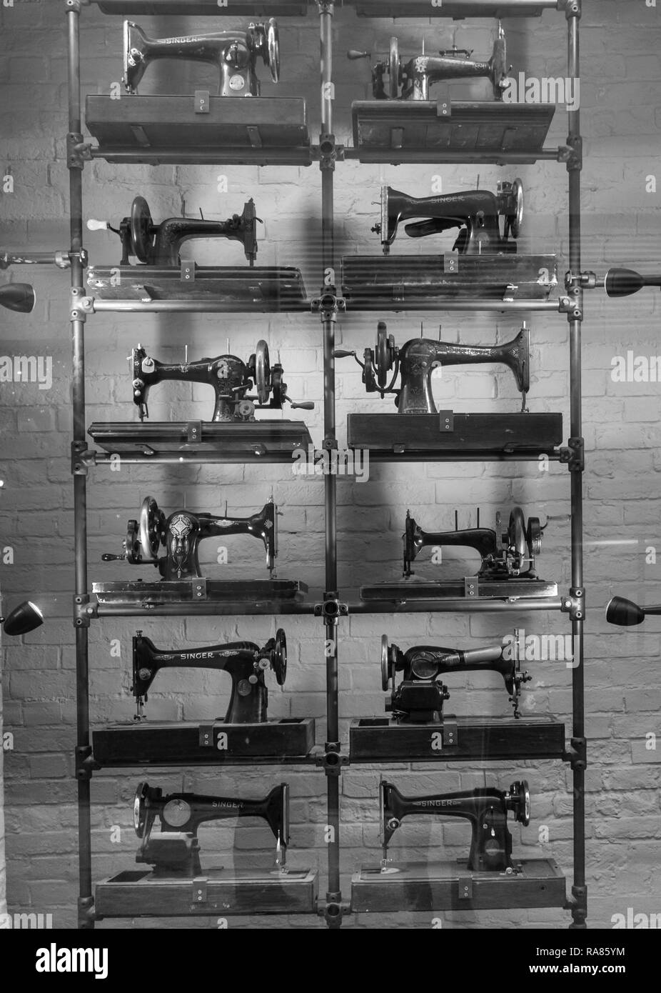 A bygone era of sewing machines, Gloucester UK. Stock Photo