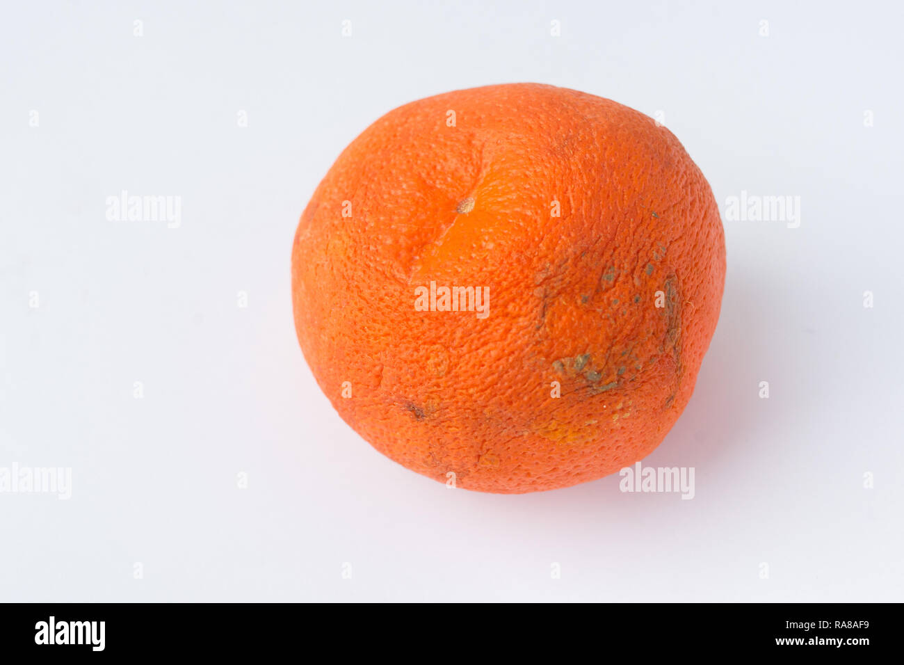Tangerine or clementine with green leaf isolated on white background