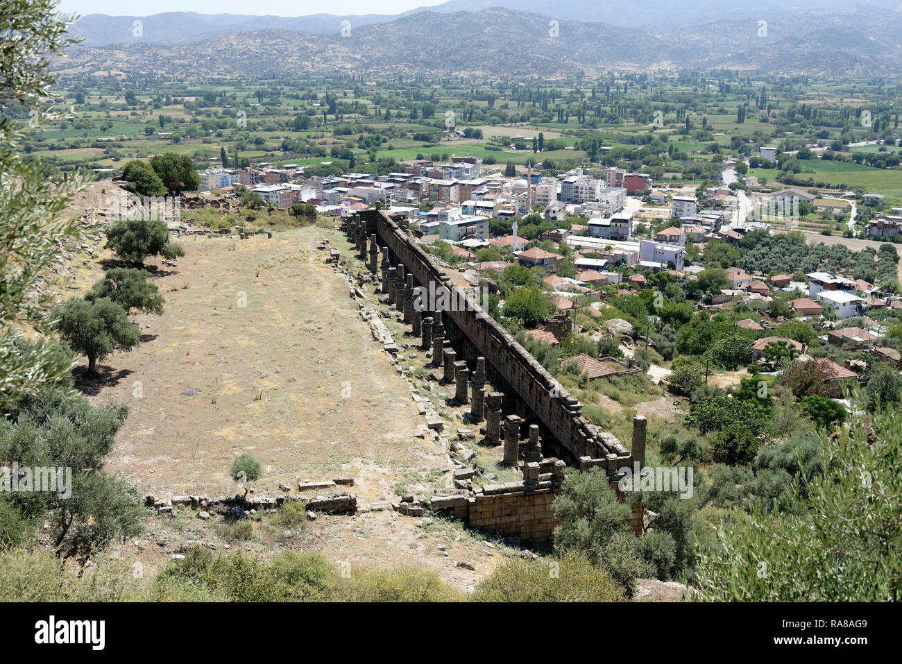 Elevated view of the Hellenistic market hall and the adjoining Agora, ancient city of Alinda, Caria, Anatolia, Turkey. The 90 metres long and 15 metre Stock Photo