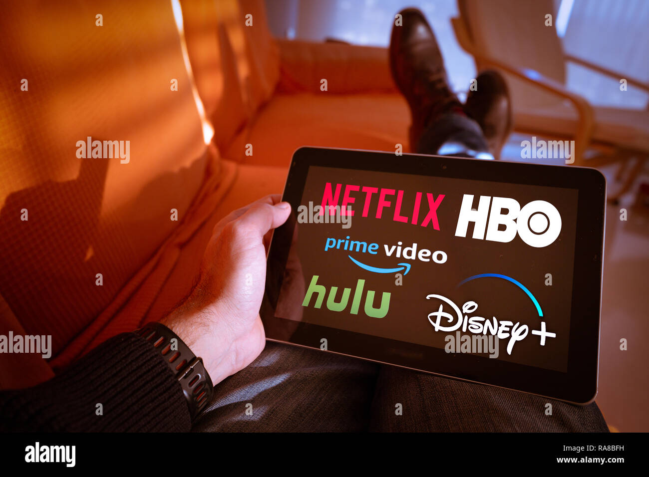 Barcelona, Spain. January 2019: Man holds a tablet with Netflix, hulu,  amazon video, HBO and Disney+ logos on screen Stock Photo - Alamy