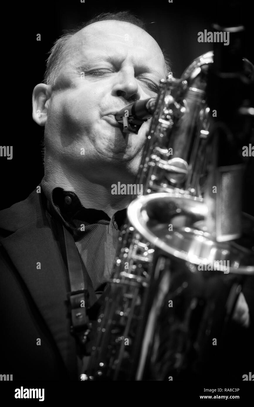 Alan Barnes soloing on baritone saxophone with The Lowest Common Denominator, Scarborough Jazz Festival 2017 Stock Photo