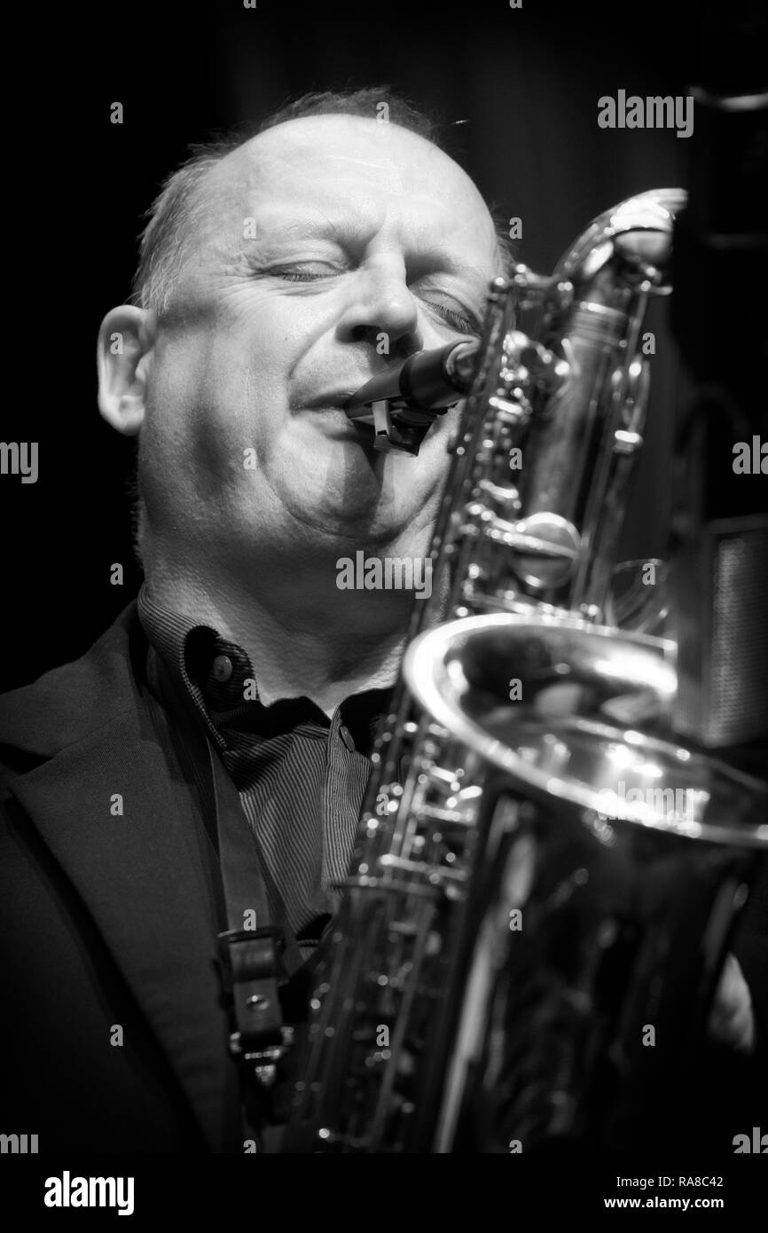 Alan Barnes soloing on baritone saxophone with The Lowest Common Denominator, Scarborough Jazz Festival 2017 Stock Photo