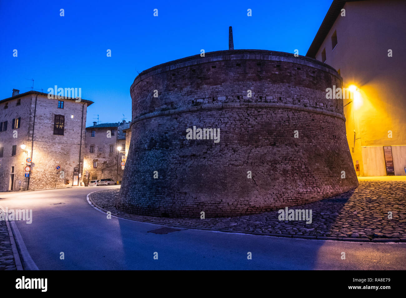 The first cistern of drinking water by night located at the entrance to the medieval village town of Colle di Val d'Elsa, Siena, Tuscany Stock Photo