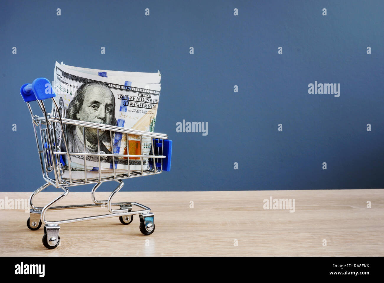 Shopping cart with money. Instant cash loans. Copy space. Stock Photo