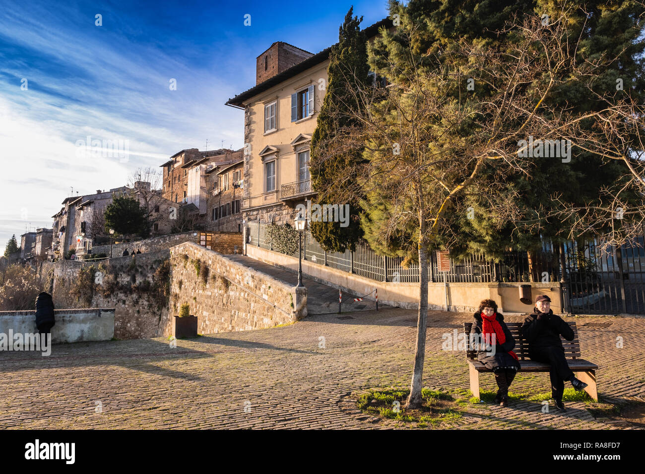 COLLE VAL D’ELSA, ITALY - DECEMBER 26, 2018: Two unknown people in the Baluardi. Panoramic view of the city in the historic center of Colle di Val d'E Stock Photo