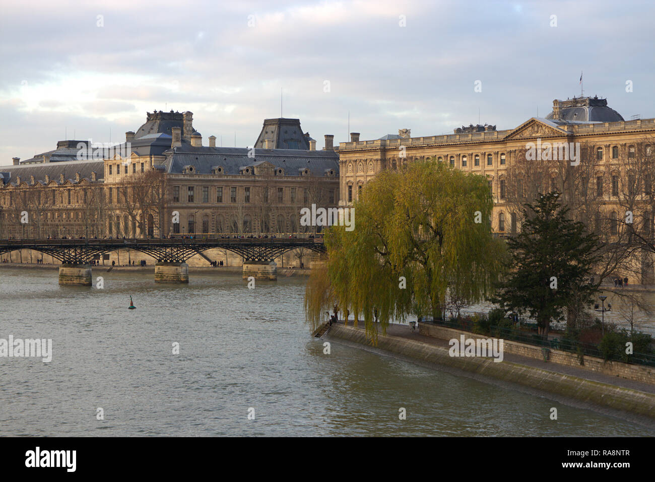 France, Paris, view of Seine River and Louvre museum  from Pont Neuf bridge with Ile de la Cité, a natural island and the centre of medieval Paris Stock Photo