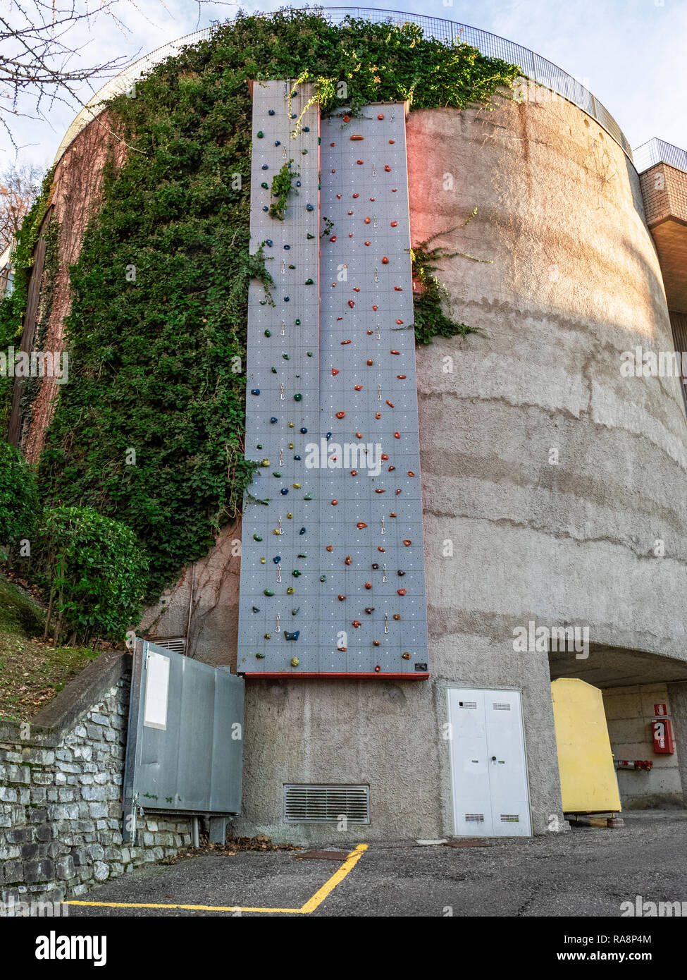 sport climbing wall placed outside a circular building Stock Photo Alamy