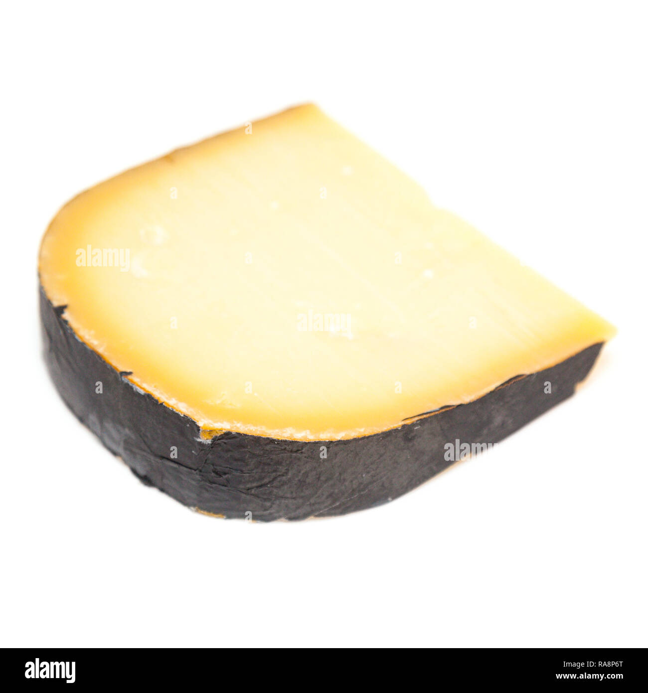 Extra mature Dutch Gouda cheese isolated on a white studio background. Stock Photo