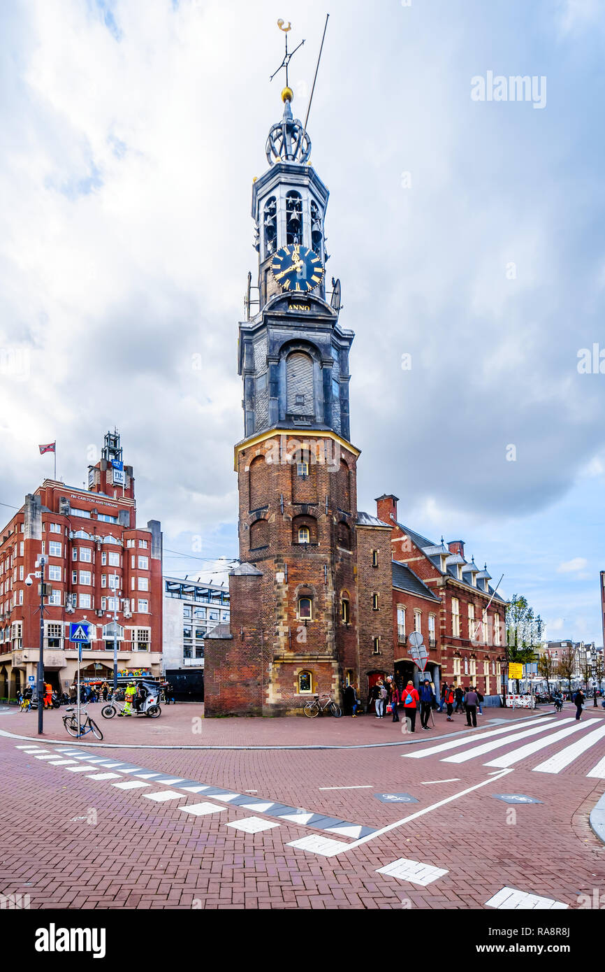 The historic Munttoren or Mint Tower with the original carillon of the 1600's in the old city center of Amsterdam in the Netherlands Stock Photo