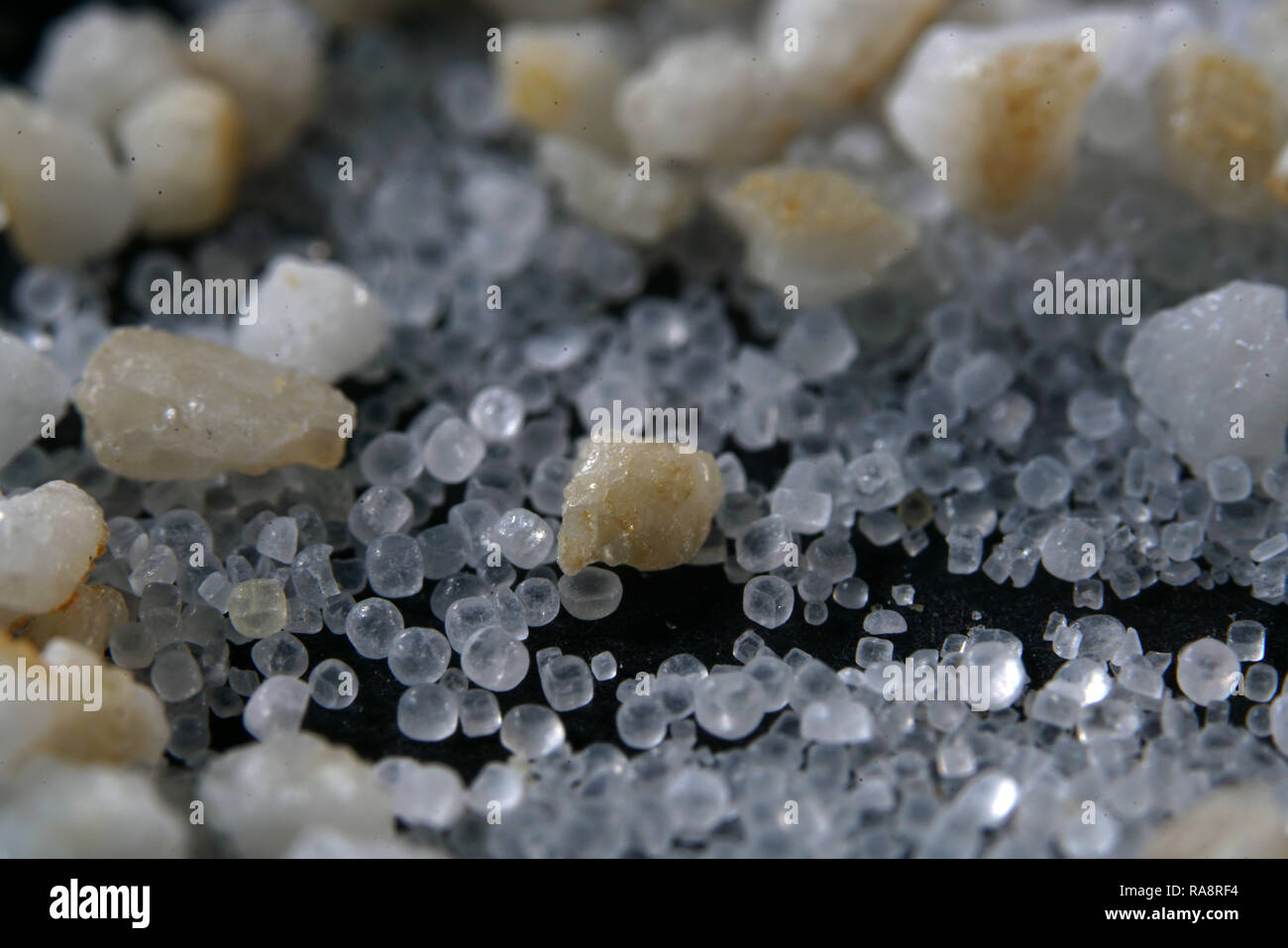 Salt in various forms with the macro lens extremely enlarged, it almost micro photographs are Stock Photo