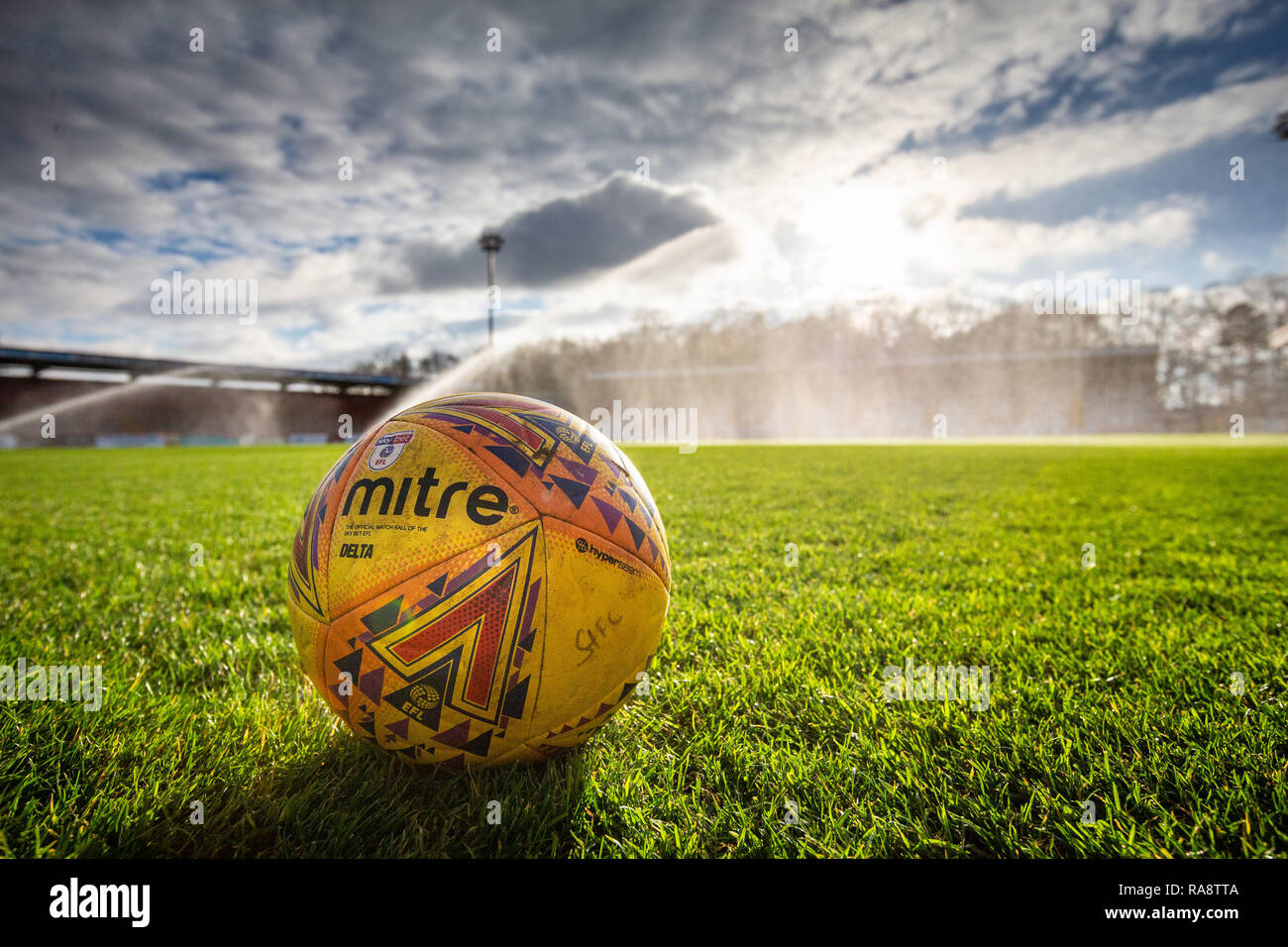 Close up of official EFL League Two football on pitch with stand in background Stock Photo