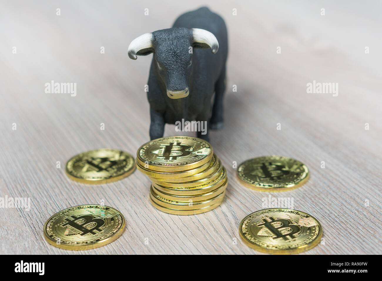 Bull market in crypto currency. Bull next to stack of bitcoin coins Stock Photo