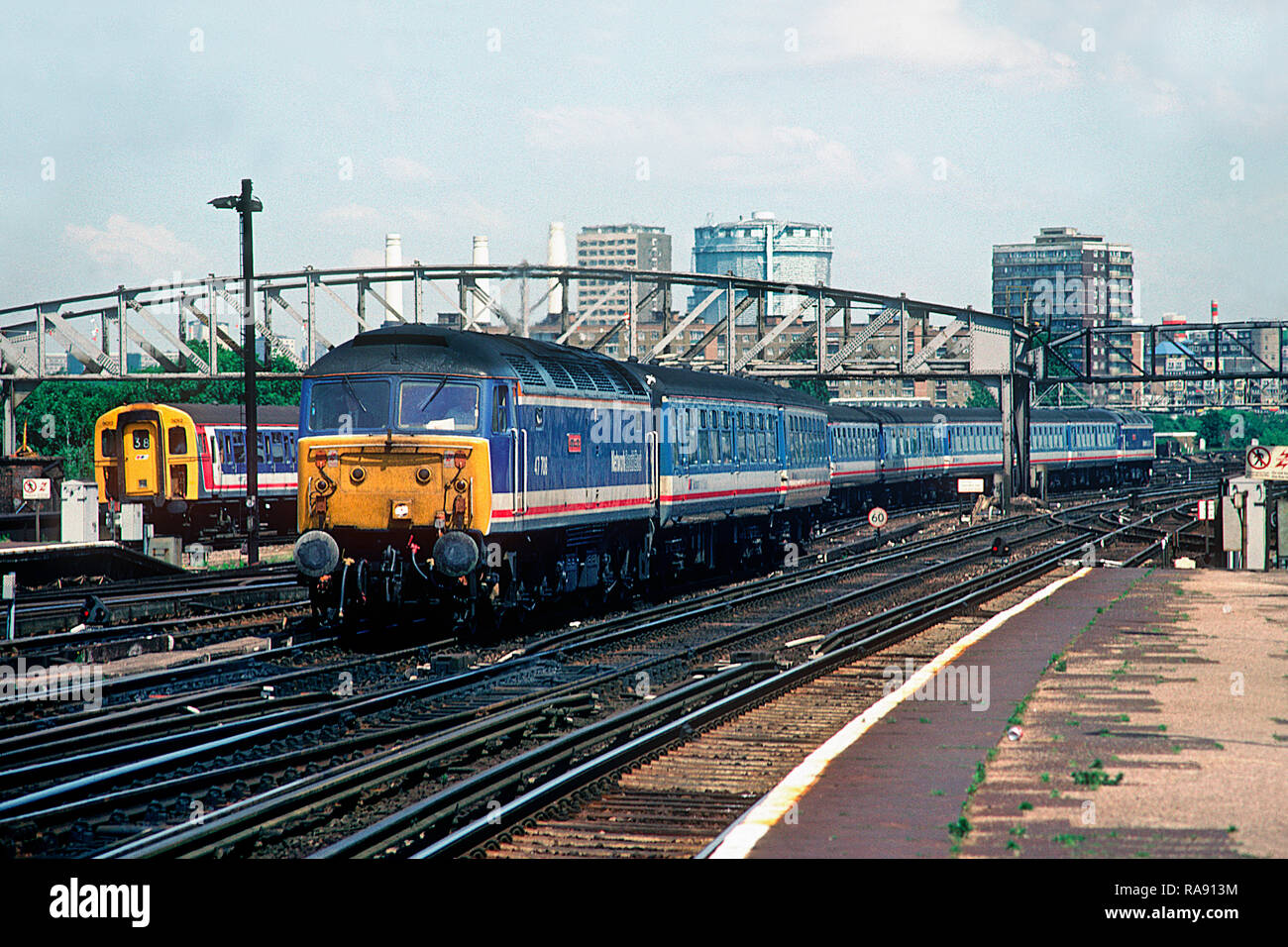 A pair of class 47 diesel locomotives numbers 47708 and 47702 top and tailing a rake of empty Network SouthEast coaching stock at Clapham Junction on the 11th June 1992. Stock Photo