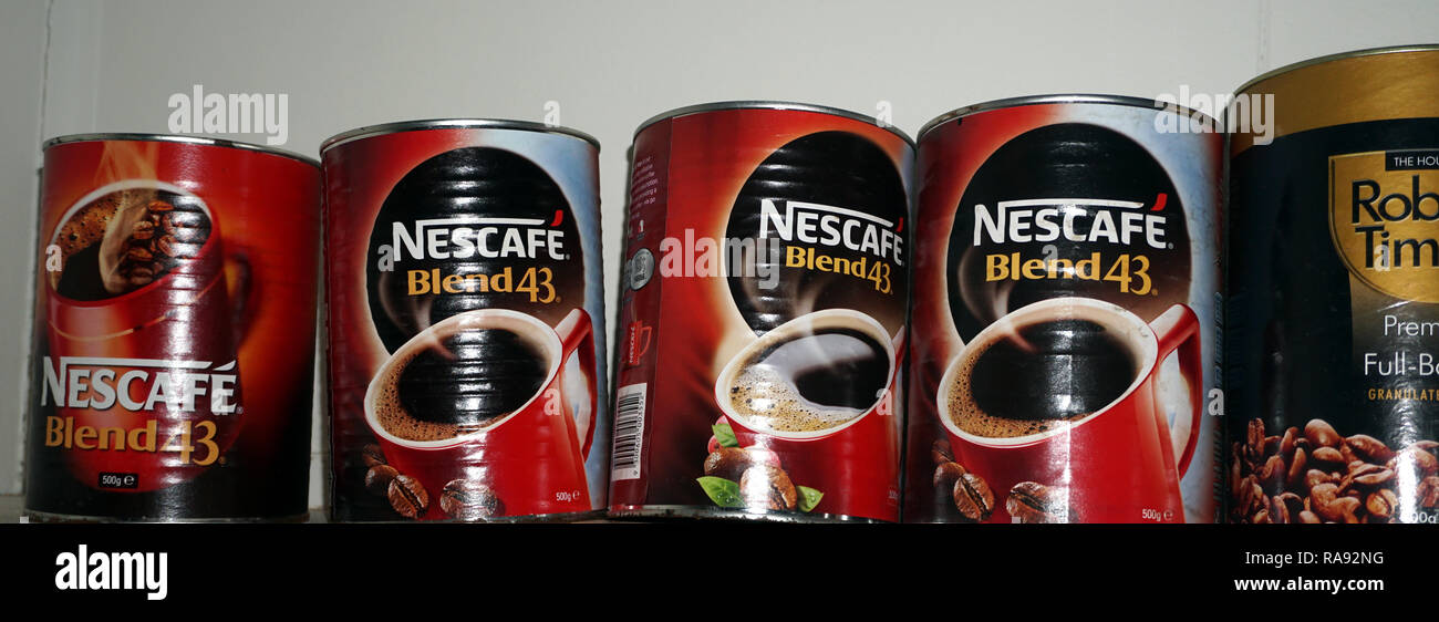 a collection of empty instant coffee tins. (Nescafe Blend 43 Instant Coffee Tin 500g & Robert Timms Instant Coffee Premium Full-bodied 500g) Stock Photo