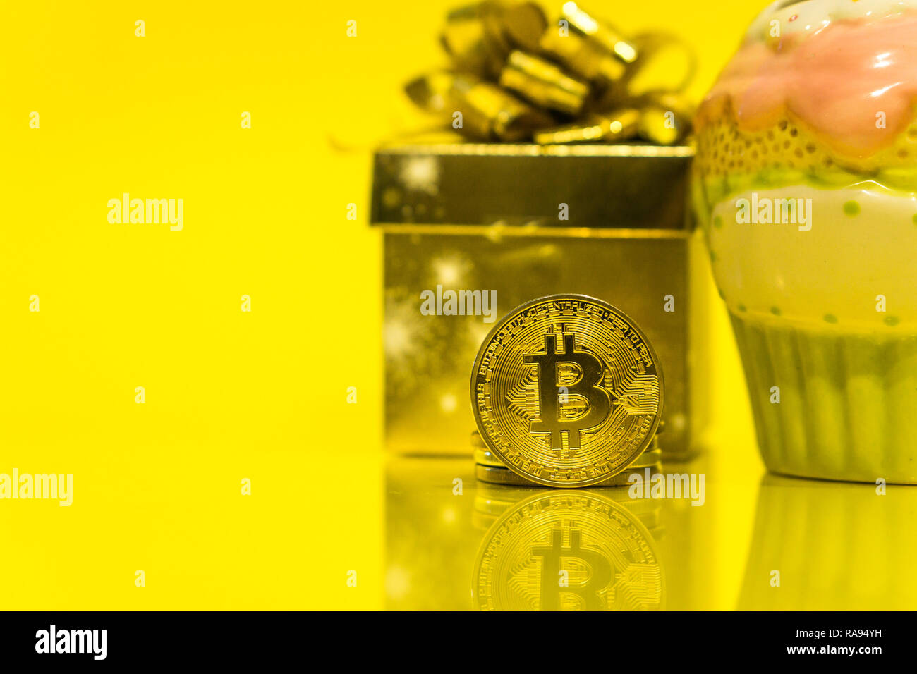 Bitcoin cryptocurrency celebrating birthday - 10 years, coin with birthday  hat behind it, with yellow copy space Stock Photo - Alamy