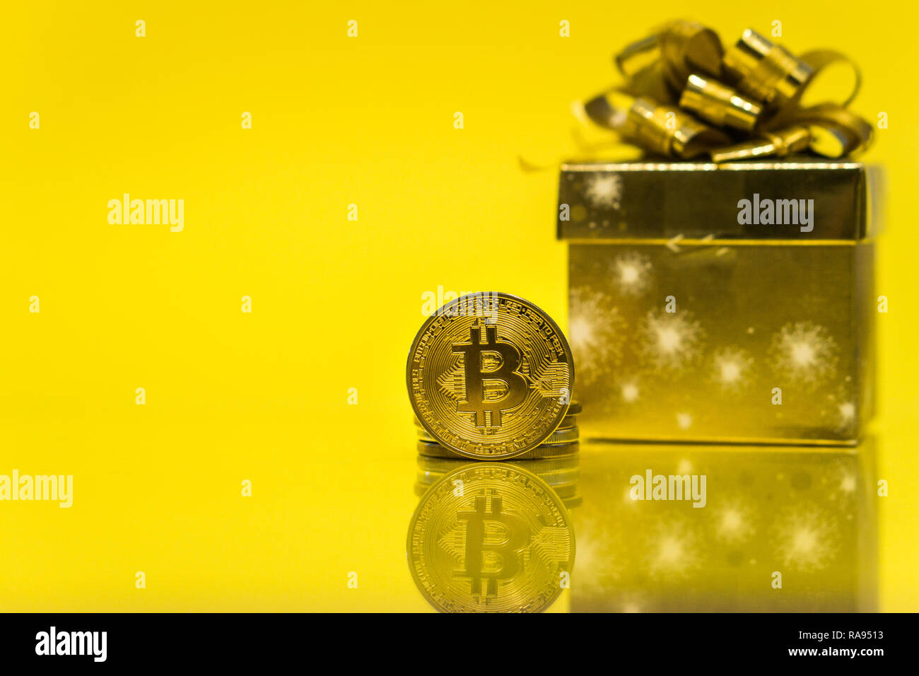 Bitcoin cryptocurrency celebrating birthday - 10 years, coin with golden  present behind it, with yellow copy space Stock Photo - Alamy