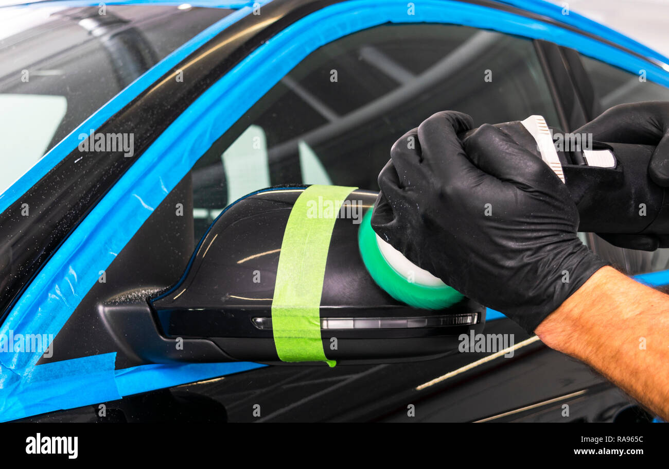 Car polish wax worker hands applying protective tape before polishing.  Buffing and polishing car. Car detailing. Man holds a polisher in the hand  and Stock Photo - Alamy