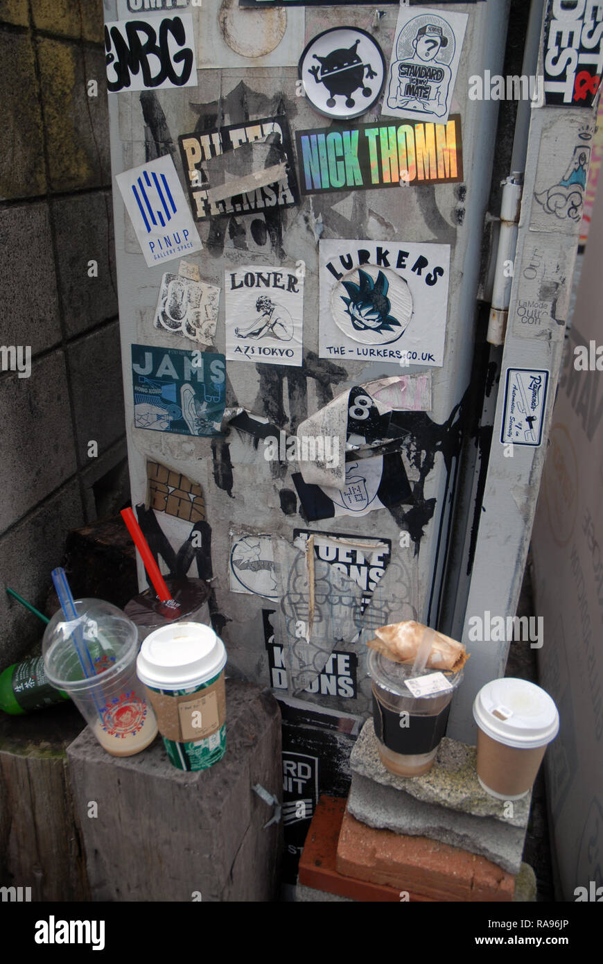 Assorted stickers stuck on lamp posts, Tokyo, Japan Stock Photo Alamy