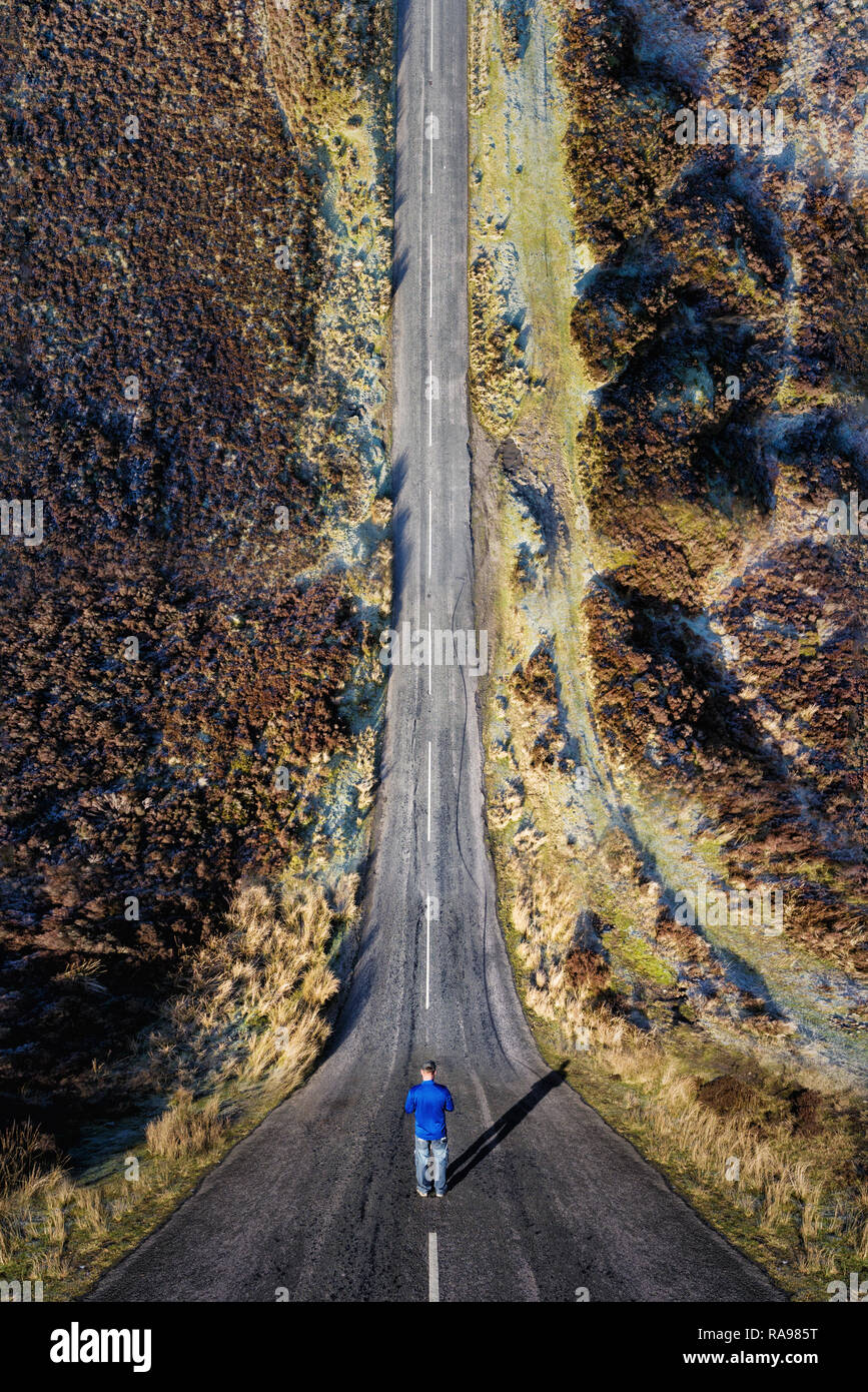 Man stood on a road with a drone bending inception effect Stock Photo -  Alamy