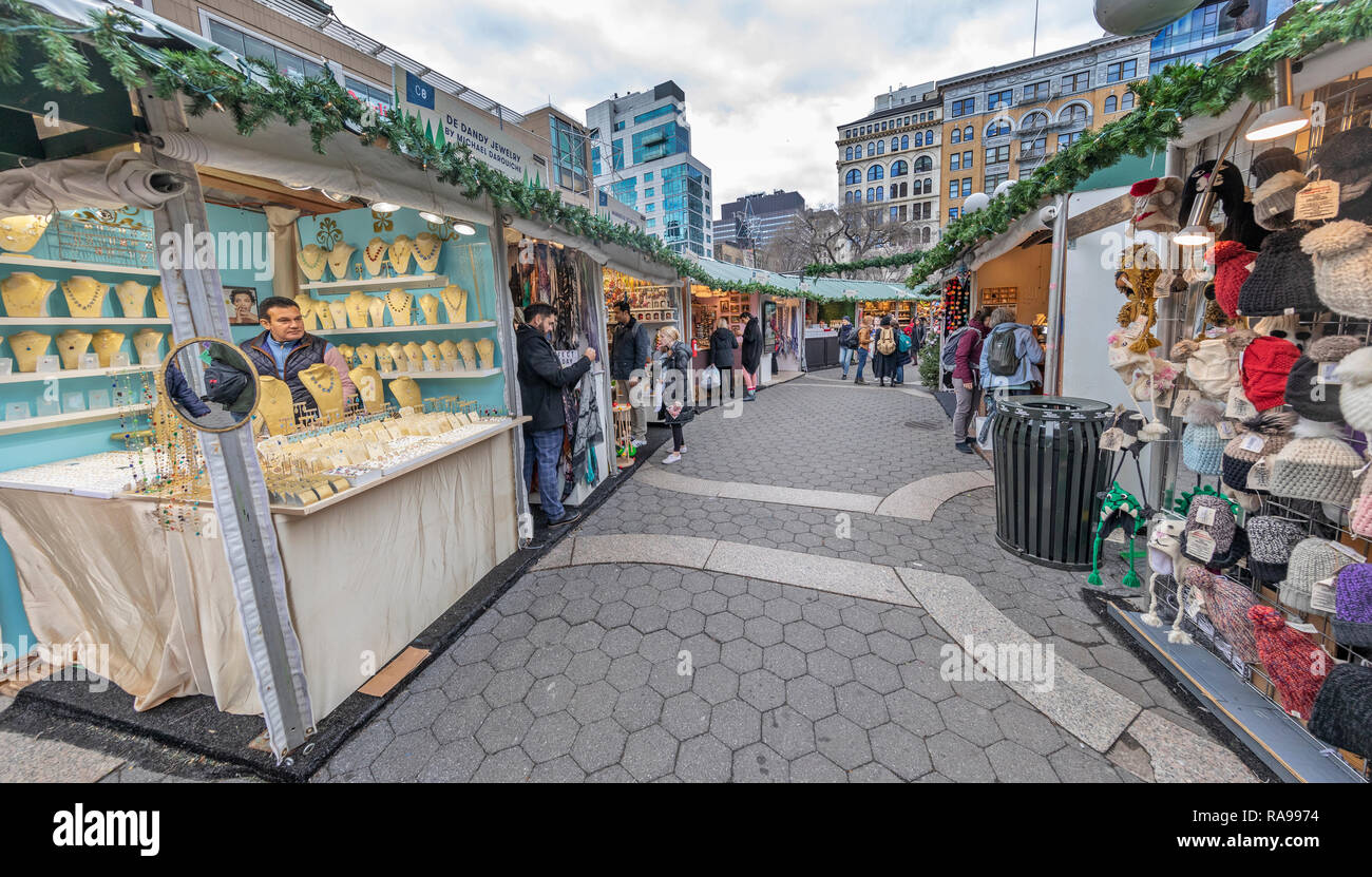Shoppers and tourists exploring the Union Square Holiday Market in Union Square, New York City. Stock Photo