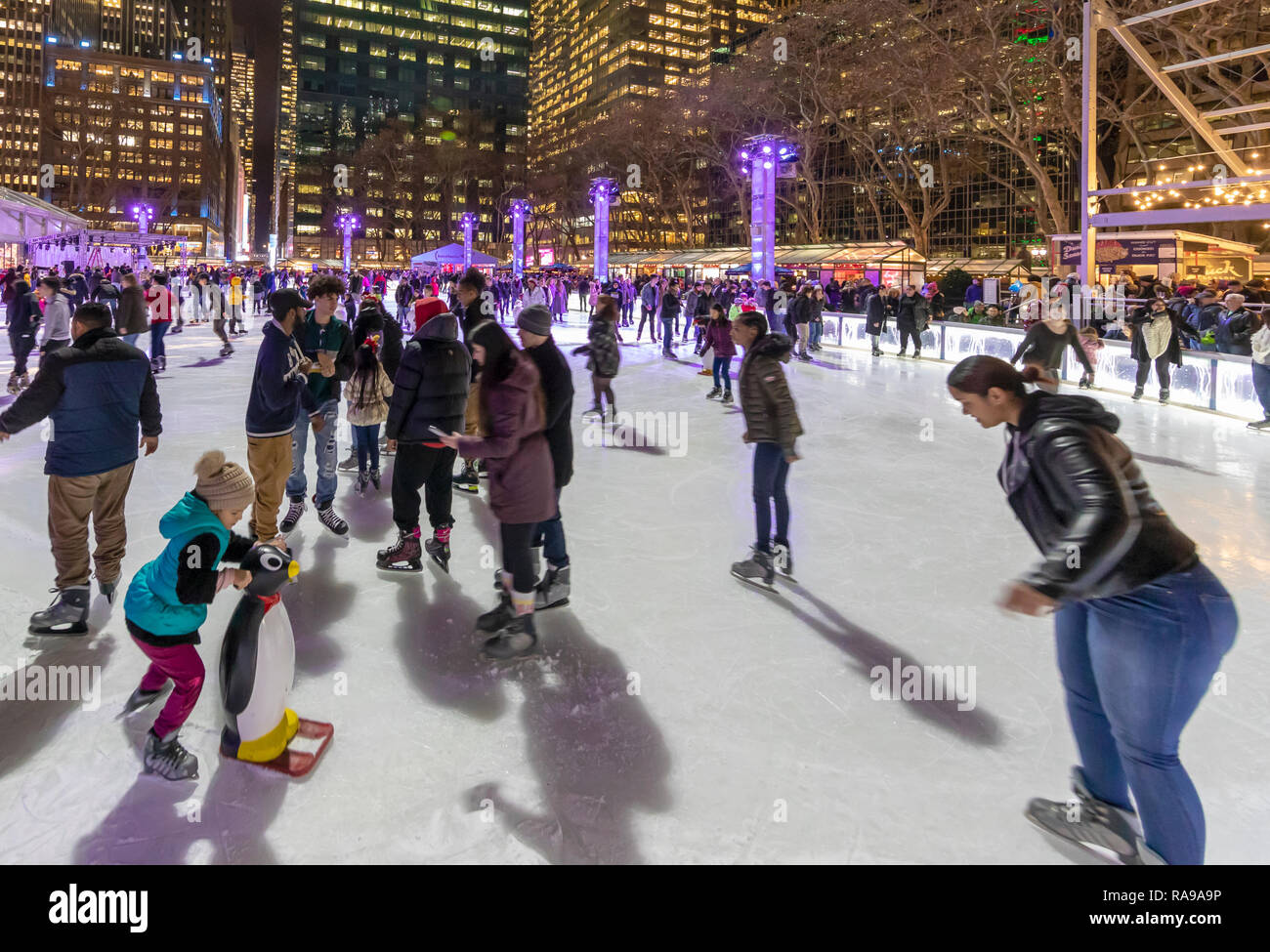 Ice Skaters at Ice skating rink at the Bryant Park Holiday Market in Bryant Park, New York City