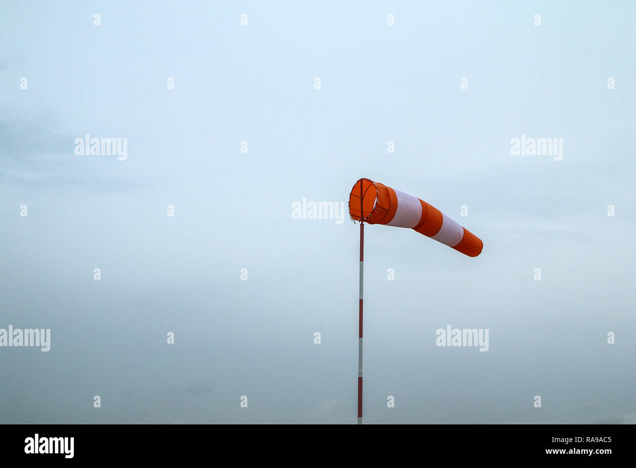 A picture of a single wind sock showing the direction of wind