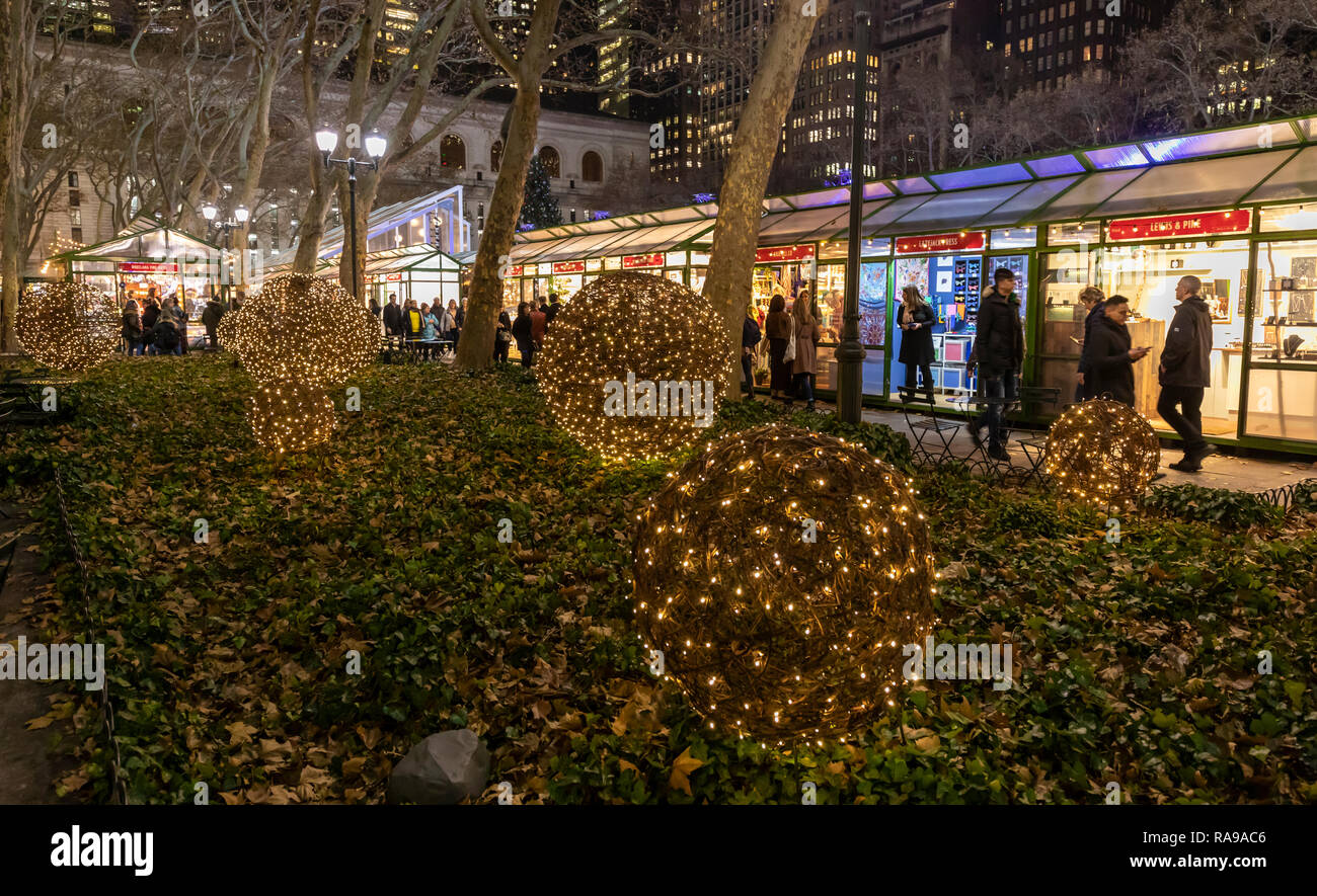 Shoppers and tourists at the Bryant Park Holiday Market in Bryant Park, New York City. Stock Photo