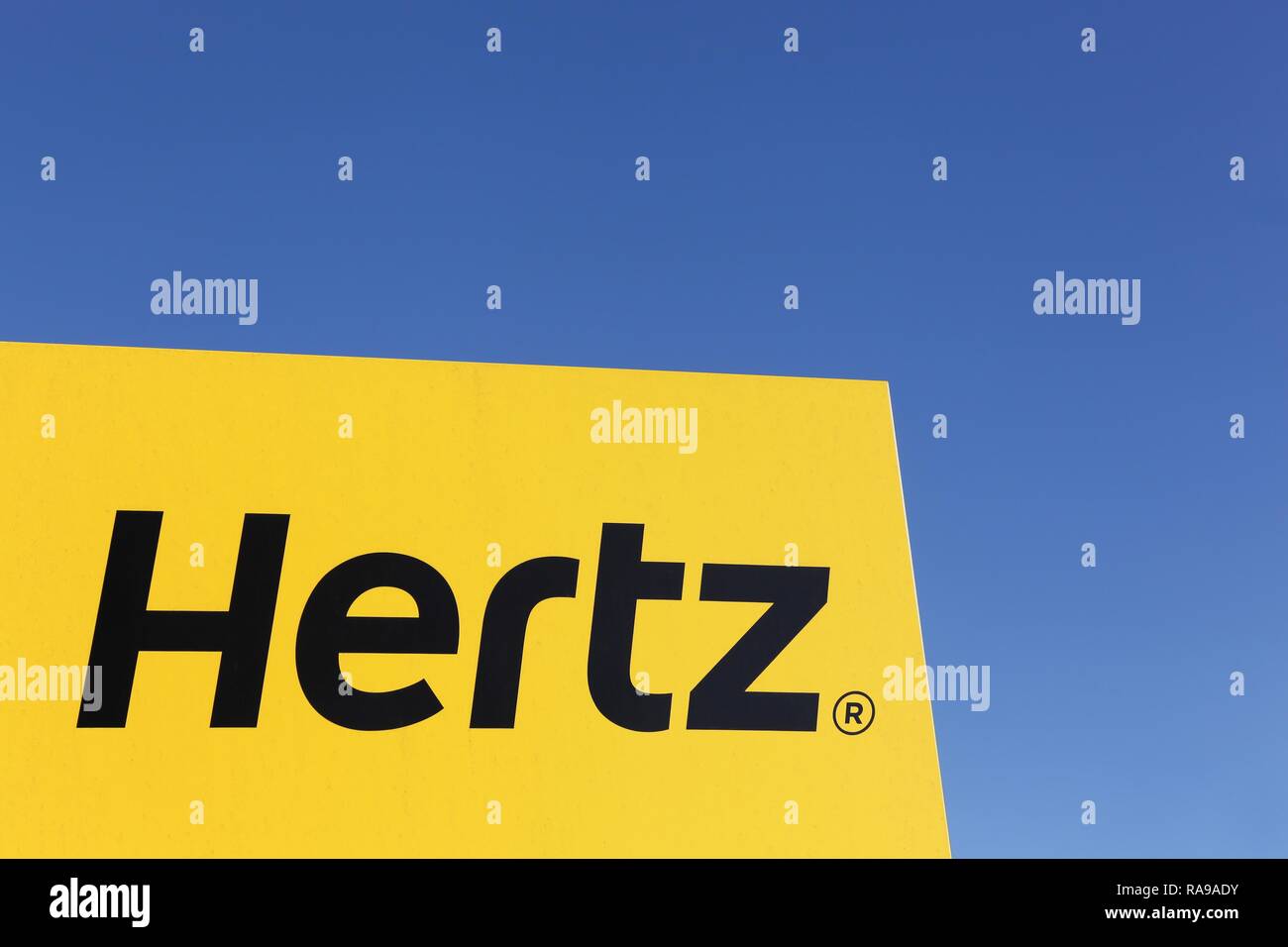 Aarhus, Denmark - February 13, 2016: Hertz logo on a panel. Hertz is an American car rental company with international locations in 145 countries Stock Photo