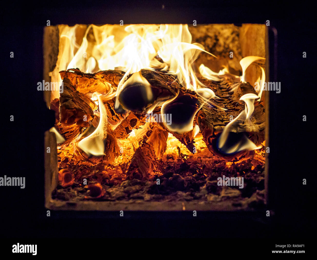 Yellow flame of firewood burning in oven Stock Photo Alamy